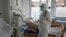 Ukraine -- Doctors provide care to patients with COVID-19, Ovruch, Zhytomyr region, 16 March 2021