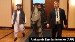 Mullah Baradar (center), the Taliban's deputy leader and chief negotiator, arrives at the Moscow conference on March 18.