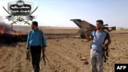 تکه‌ای از جنگنده میگ ۲۱ که گفته می‌شود به دست شورشیان در استان ادلب سرنگون شده است. تصویر مربوط به ویدیویی است که روز سه‌شنبه چهارم سپتامبر بر روی اینترنت قرار گرفته است