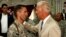 Then-U.S. Vice President Joe Biden talks with his son, U.S. Army Captain Beau Biden, at Camp Victory on the outskirts of Baghdad in July 2009.