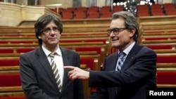 Карлес Пьюджмонт(с) һәм Артур Мас