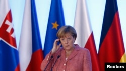 Ангела Меркель (на встрече с "Вышеградской четверкой" (Варшава, 26 августа 2016 года)