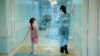 A mother and daughter walk through a hallway at the Russian Children's Clinical Hospital in Moscow. (file photo)