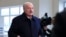 Belarusian President Alyaksandr Lukashenka speaks to journalists as he visits the paper factory in Dobrush on February 4.