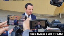 Kosovar Prime Minister Albin Kurti talks to the press during his visit to Brussels on April 28.