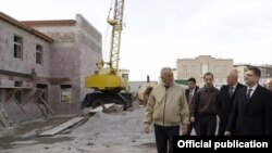 Armenia -- Prime Minister Tigran Sarkisian (R) inspects government-financed homes built in Stepanavan, 29Dec2010.