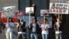 Armenia - Members of the Founding Parliament opposition movement hold up pictures of its arrested leaders during a rally in Yerevan, 17Apr2015.