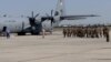 Armenia - Armenian troops board a U.S. military transport plane bound for Kosovo at Yerevan airport, 6Jul2012.