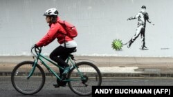 یک گرافیتی الهام‌گرفته از همه‌گیری کرونا در گلاسکوی بریتانیا