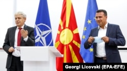 SDSM leader Zoran Zaev (right) and BDI leader Ali Ahmeti announce that they have reached a deal for forming a new government in Skopje on August 18.