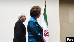 محمدجواد ظریف، وزیر خارجه جمهوری اسلامی ایران و کاترین اشتون، مسئول سیاست خارجه اتحادیه اروپا. در ژنو سوئیس.