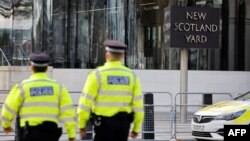 British police officers patrol in front of New Scotland Yard, central London. (file photo)