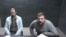 Aleksandr Chikalo (left) and Ivan Bliznyuk participate in a Buenos Aires court hearing via video link from Marcos Paz prison in June 2021.