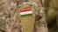 Tajikistan flag on soldiers arm (collage).