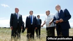 Armenia - Prime Minister Hovik Abrahamian (second from left) inspects a wheat field in Shirak province seriously damaged by a hailstorm, 9Jul2014