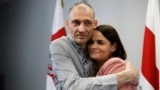 Belarusian opposition activist Syarhey Tsikhanouski embraces his wife, opposition leader Svyatlana Tsikhanouskaya, after his release from prison in June.
