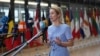 European Union foreign policy chief Kaja Kallas speaks with the media as she arrives for a meeting of EU foreign ministers on June 23. 