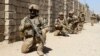 Afghan National Army commandos take up positions during a military operation in Helmand Province.