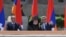 Nagorno-Karabakh - Armenian President Serzh Sarkisian (R) and former President Robert Kocharian (L) watch a military parade in Stepanakert, 09May2012.