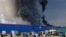 Plumes of smoke rise from the blaze at the Ozon warehouse near Istra, a village about 40 kilometers northwest of Moscow.