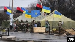 Ukrainian nationalist protesters and military veterans take part in the trade blockade at the Kryvyy Torets railway station last moth.