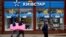 People walk past a store of Kyivstar, Ukraine's major telecommunications company, in Kyiv on December 12.