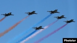 Armenian Su-25 combat aircraft fly during a military parade in Yerevan in September 2016.