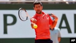 Novak Djokovic plays a shot his first-round match of the French Open at Roland Garros stadium in Paris on May 29.