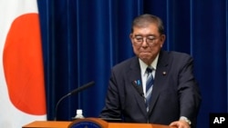 Сигэру Исиба.