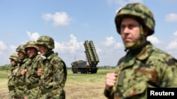 Serbian Army soldiers stand near the Chinese medium-range missile system FK-3, the latest weapon received by the Serbian Army, during a demonstration of Serbian Army's air defence capabilities, "Shield 2022", at the military airport "Colonel-pilot Milenko Pavlovic" in Batajnica, near Belgrade, Serbia, April 30, 2022