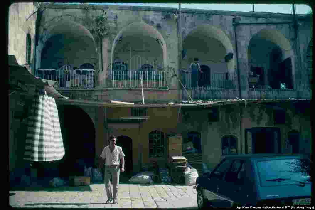 A courtyard in Aleppo photographed in 1981. Through the 1980s, with repression on the rise, an increasingly militant group, Muslim Brotherhood, carried out a series of attacks targeting the regime, including the massacre of 50 Alawite soldiers, an assassination attempt on Assad, and a bloody attempted uprising.