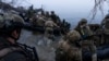 Ukrainian soldiers board a boat on the shore of the Dnieper River at the front line near Kherson, Ukraine, on October 15. The Ukrainian military has been seeking to establish several bridgeheads on the east bank in recent weeks. 