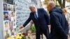 French Minister for Europe and Foreign Affairs Jean-Noel Barrot (right) and Ukrainian Foreign Minister Andriy Sybiha visit the Memory Wall of Fallen Defenders of Ukraine outside St. Michael's Cathedral in Kyiv on October 19.