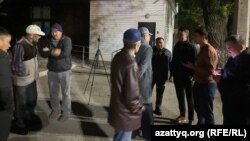Supporters of the activists opposed to building a nuclear power plant in Kazakhstan gather outside the Almaty police station after the activists were detained on September 29.