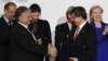 Switzerland -- Turkish Foreign Minister Ahmet Davutoglu (2ndR) and his Armenian counterpart Eduard Nalbandiana (2nd L) shake hands as they hold signed documents after a signing ceremony, Zurich, 10Oct2009