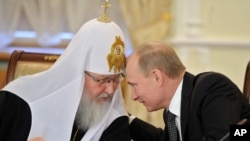 Кіраўнік Расейскай праваслаўнай царквы Кірыл і прэзыдэнт Расеі Ўладзімір Пуцін. Ілюстрацыйнае фота