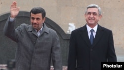 Armenia - President Serzh Sarkisian (R) meets his visiting Iranian counterpart Mahmud Ahmadinejad in Yerevan,23Dec2011.