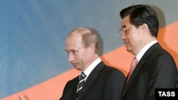 Rusiä prezident Vladimir Putin (s) häm Qıtay prezidentı Hu Jintao Rusiädä Qıtay yılın aça, Mäskäw, 26Mar2007
