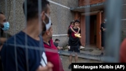 Мігранты з Іраку ў літоўскім лягеры ўцекачоў, 11 ліпеня 2021, ілюстрацыйнае фота. 