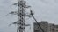 A municipal worker repairs a power line after a Russian missile attack on the northeastern Ukrainian city Kharkiv. (file photo)
