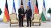 German President Frank-Walter Steinmeier (left) and Uzbek President Shavkat Mirziyoev meet in Tashkent on May 28.