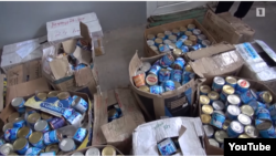 Обнаруженные СНБ в принадлежащих Манвелу Григоряну помещениях коробки со сгущенкой