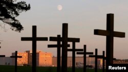 День пам’яті жертв політичних репресій в Білорусі очима кореспондента Reuters