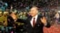 Kazakhstan - FILE PHOTO: Kazakh President Nursultan Nazarbayev waves to supporters after his victory in the presidential election was officially announced in Astana, Kazakhstan December 5, 2005. REUTERS/Stringer/File Photo