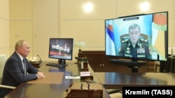 RUSSIA -- Russian President Vladimir Putin speaks with Chief of the Russian Armed Forces' General Staff Valery Gerasimov, via a video conference call at the Novo-Ogaryovo state residence, outside Moscow, October 7, 2020
