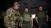 Ukrainians President Volodymyr Zelenskiy (center) visits members of his military's Special Operation Forces near Bakhmut on July 29. 