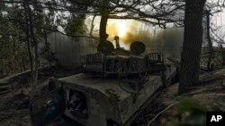 A Ukrainian self-propelled artillery system fires toward Russian positions at the front line near Bakhmut on September 1.