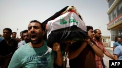 مراسم خاکسپاری قربانیان حملات بغداد