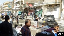 محل یکی از انفجارهای بغداد. ۲۸ اوت ۲۰۱۳.