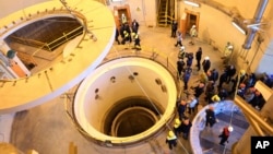 Technicians work at the Arak heavy water reactor's secondary circuit near Arak, Iran. (file photo)